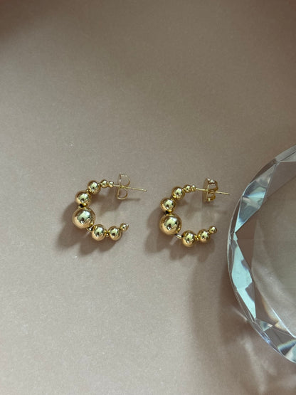 Hoop earrings with gold plated stacks, elegant.